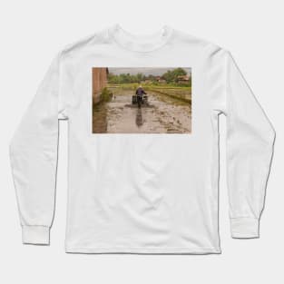 A man in backside view plows a village rice field. Long Sleeve T-Shirt